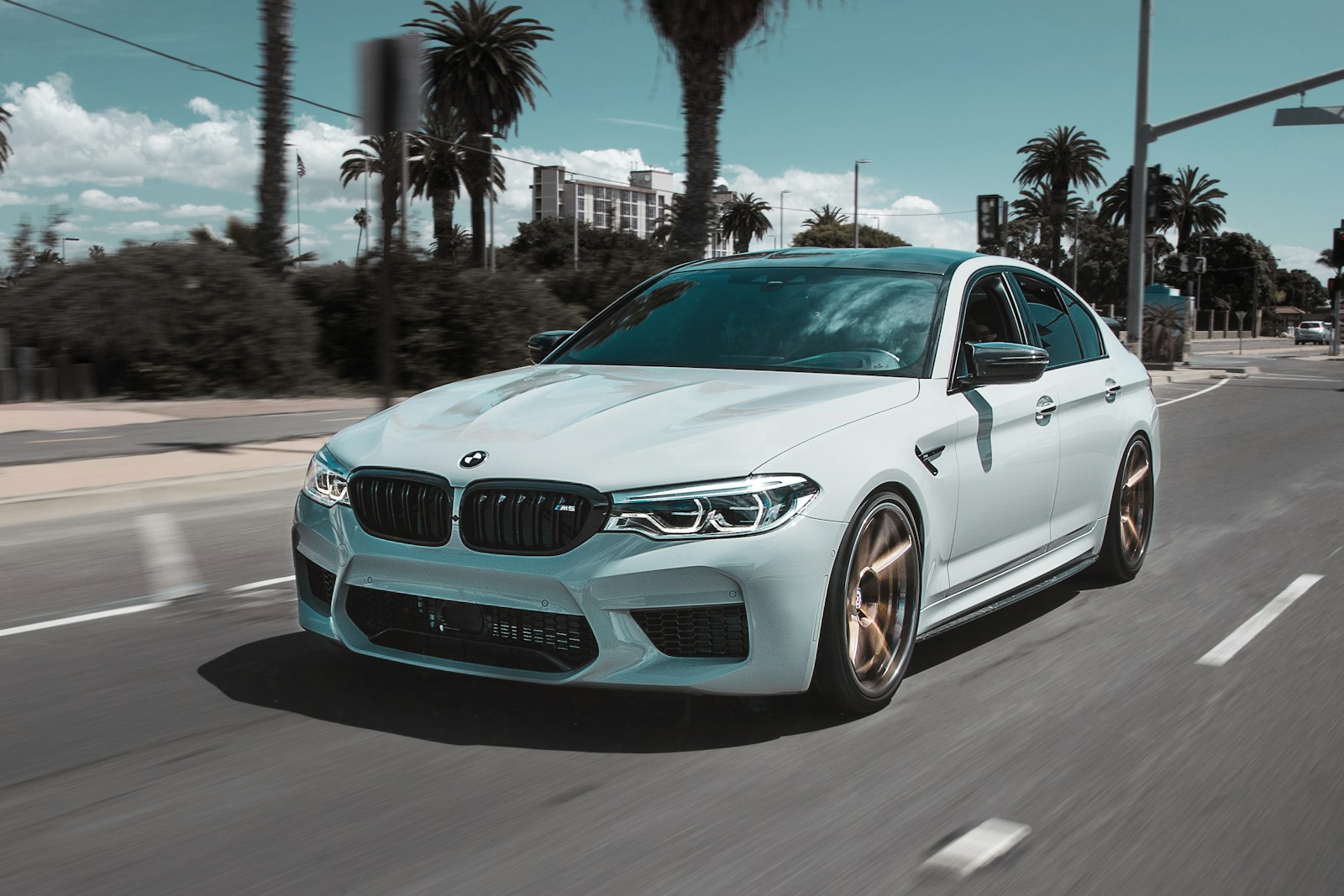 White BMW M5, front three-quarter view