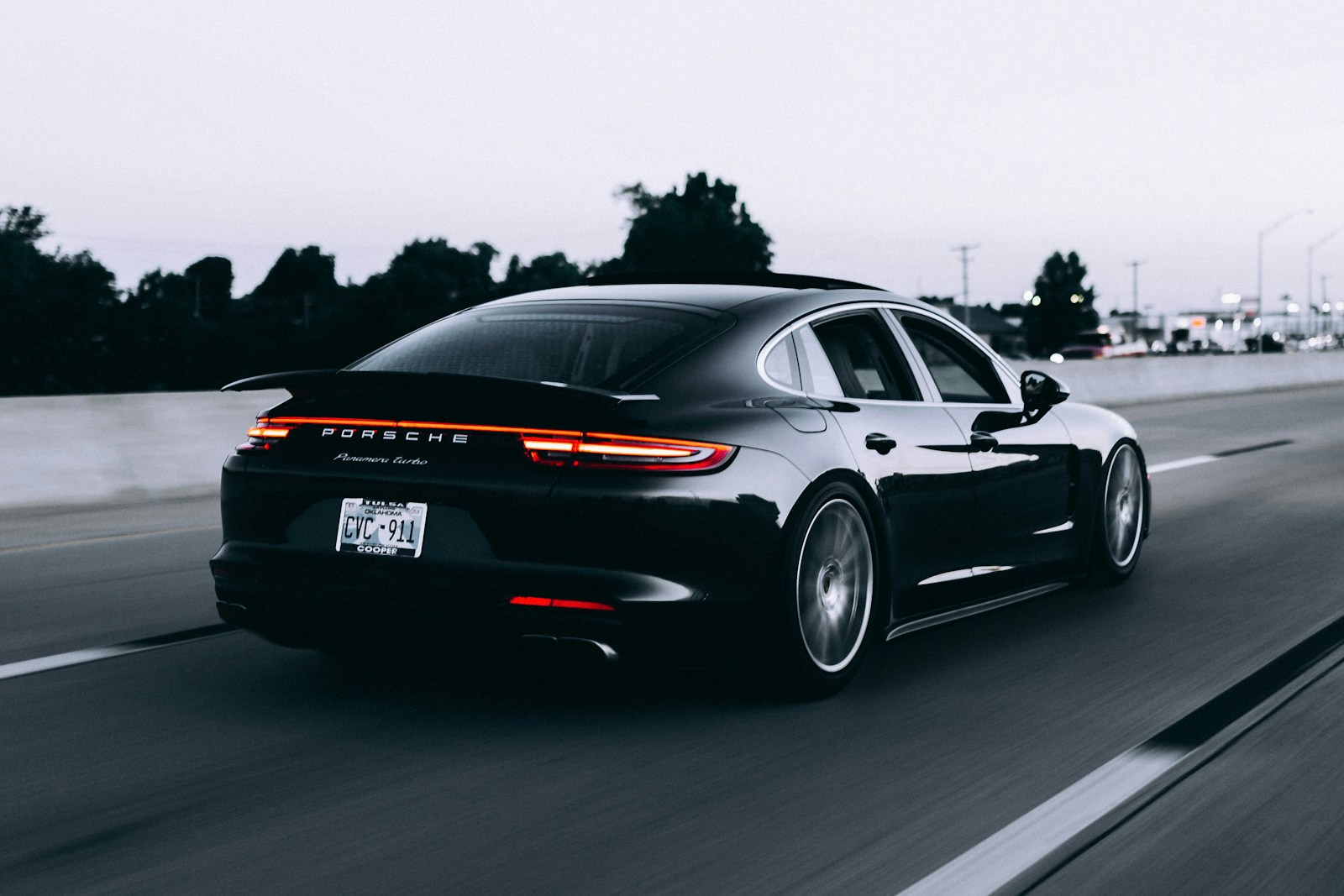 Black Porsche Panamera Turbo, rear three-quarter view